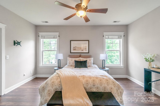 2619 Merion Hills Ct, Charlotte, NC 28269 - bedroom with multiple windows, wood finished floors, and ceiling fan
