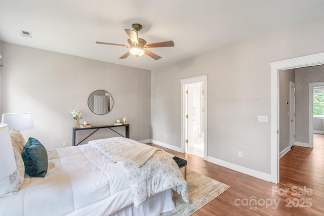 2619 Merion Hills Ct, Charlotte, NC 28269 - bedroom with wood finished floors, ceiling fan, and ensuite bath