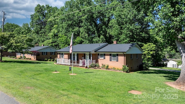 135 Burton Hills Cir, Gastonia, NC 28054 - single story home with a porch, a front lawn, brick siding, and a chimney