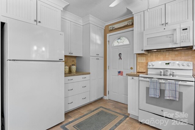135 Burton Hills Cir, Gastonia, NC 28054 - kitchen with white appliances, decorative backsplash, white cabinets, crown molding, and light stone finish flooring