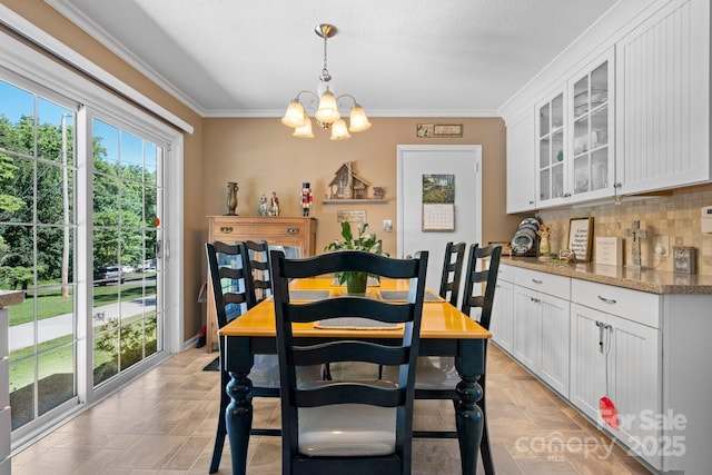 135 Burton Hills Cir, Gastonia, NC 28054 - dining room featuring a chandelier, ornamental molding, light tile patterned floors, and a textured ceiling