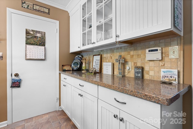 135 Burton Hills Cir, Gastonia, NC 28054 - bar area with stone finish flooring, decorative backsplash, and crown molding