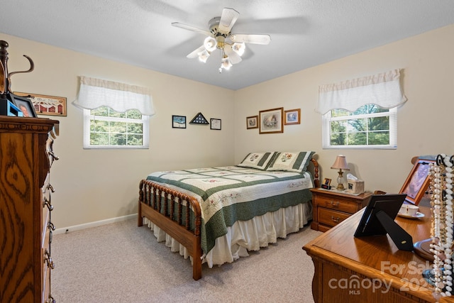 135 Burton Hills Cir, Gastonia, NC 28054 - bedroom featuring multiple windows, light carpet, and a ceiling fan