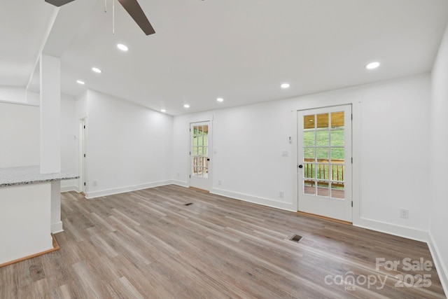 431 Pole Miller Ext, Brevard, NC 28712 - unfurnished living room with light wood finished floors, ceiling fan, and recessed lighting