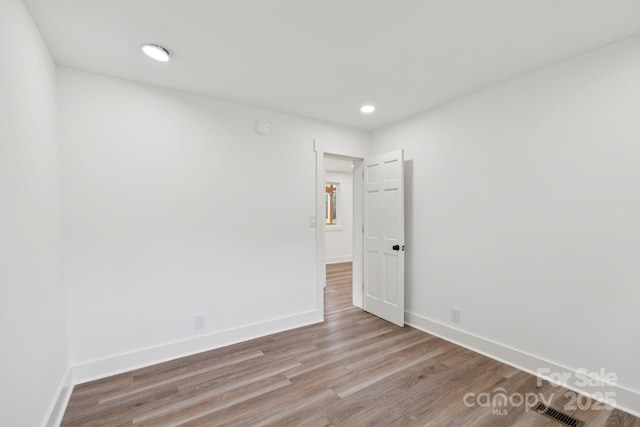 431 Pole Miller Ext, Brevard, NC 28712 - spare room featuring wood finished floors, recessed lighting, and a smoke detector