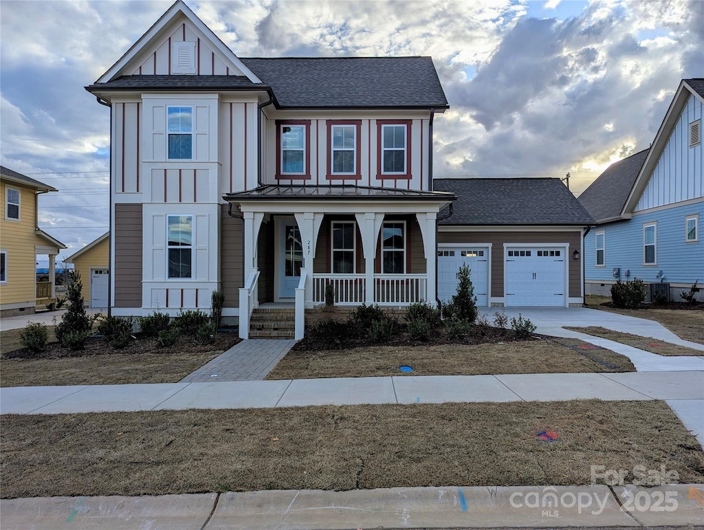 287 Luray Way Unit 450, Rock Hill, SC 29730 - view of front of home with a porch, driveway, an attached garage, roof with shingles, and board and batten siding