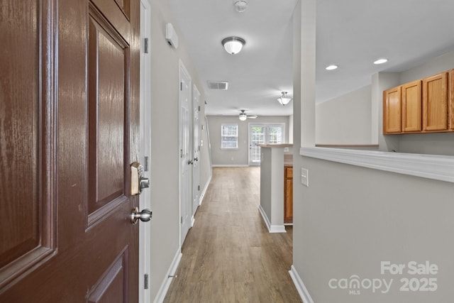 12516 Hennigan Place Ln, Charlotte, NC 28214 - corridor with light wood-type flooring and recessed lighting