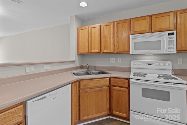 12516 Hennigan Place Ln, Charlotte, NC 28214 - kitchen featuring white appliances, light countertops, and dark wood finished floors