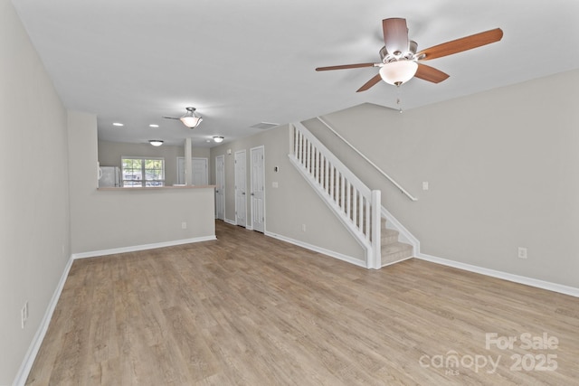 12516 Hennigan Place Ln, Charlotte, NC 28214 - unfurnished living room with a ceiling fan, wood finished floors, and stairway