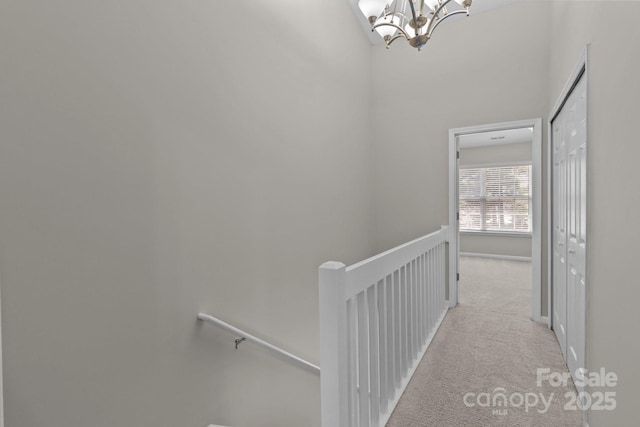 12516 Hennigan Place Ln, Charlotte, NC 28214 - hall featuring an upstairs landing, a chandelier, and carpet floors