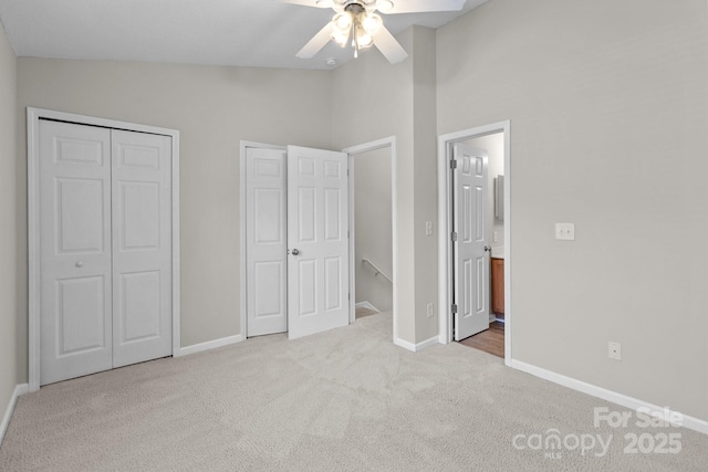 12516 Hennigan Place Ln, Charlotte, NC 28214 - unfurnished bedroom with carpet flooring, multiple closets, ceiling fan, ensuite bath, and high vaulted ceiling