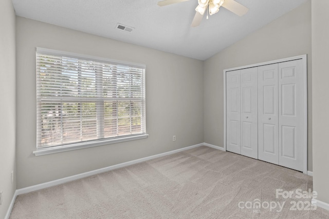 12516 Hennigan Place Ln, Charlotte, NC 28214 - unfurnished bedroom featuring carpet, lofted ceiling, a closet, and ceiling fan