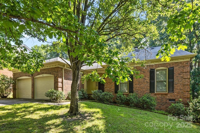 212 Foxfield Ln, Matthews, NC 28105 - view of front of house featuring brick siding, driveway, an attached garage, and a front lawn