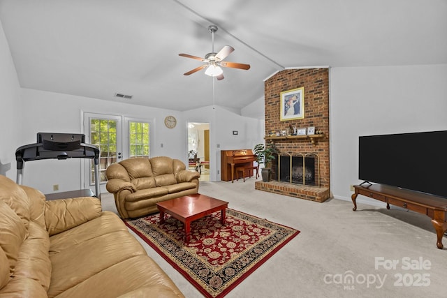 212 Foxfield Ln, Matthews, NC 28105 - carpeted living room featuring vaulted ceiling, ceiling fan, french doors, and a brick fireplace