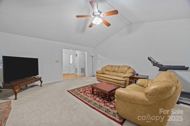 212 Foxfield Ln, Matthews, NC 28105 - carpeted living room with ceiling fan and lofted ceiling