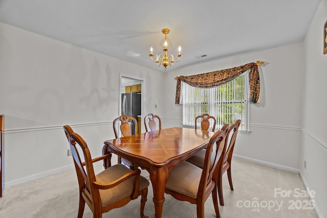 212 Foxfield Ln, Matthews, NC 28105 - dining area featuring a chandelier and light colored carpet
