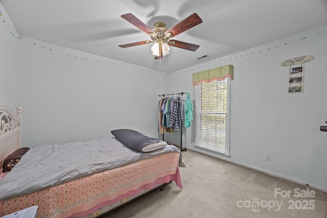 212 Foxfield Ln, Matthews, NC 28105 - carpeted bedroom with ceiling fan and baseboards