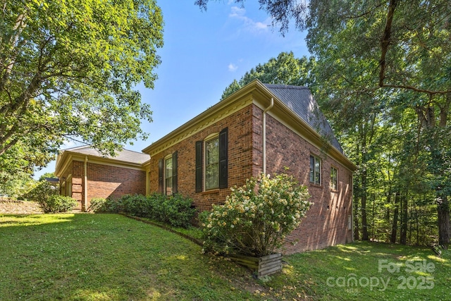 212 Foxfield Ln, Matthews, NC 28105 - view of side of property with a lawn and brick siding