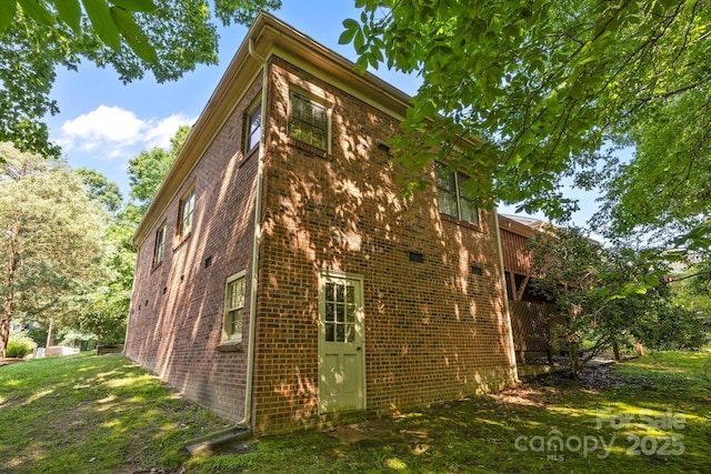212 Foxfield Ln, Matthews, NC 28105 - view of home's exterior featuring brick siding and a lawn