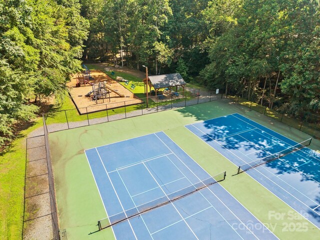 212 Foxfield Ln, Matthews, NC 28105 - view of tennis court featuring a forest view