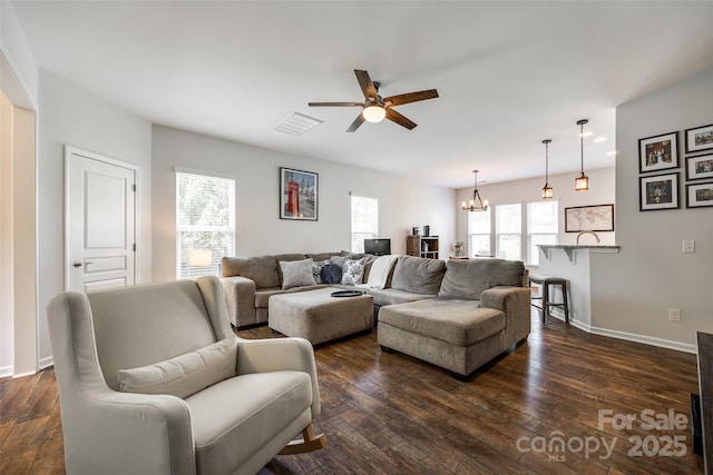 4107 Park S Station Blvd, Charlotte, NC 28210 - living room featuring a chandelier, a ceiling fan, and dark wood-style flooring
