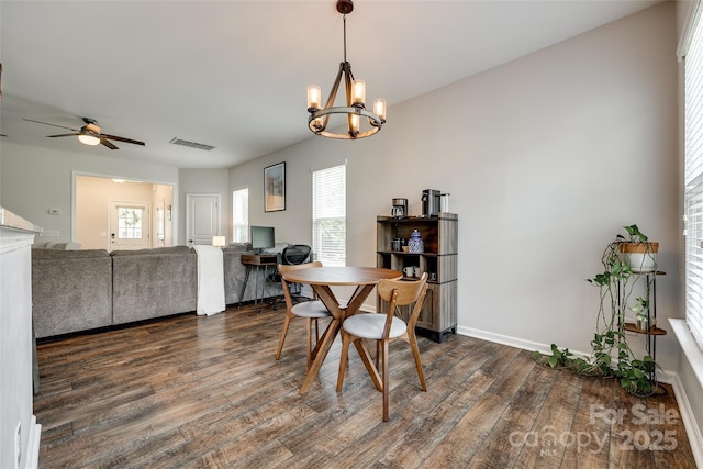 4107 Park S Station Blvd, Charlotte, NC 28210 - dining space with dark wood-type flooring, ceiling fan, and a chandelier