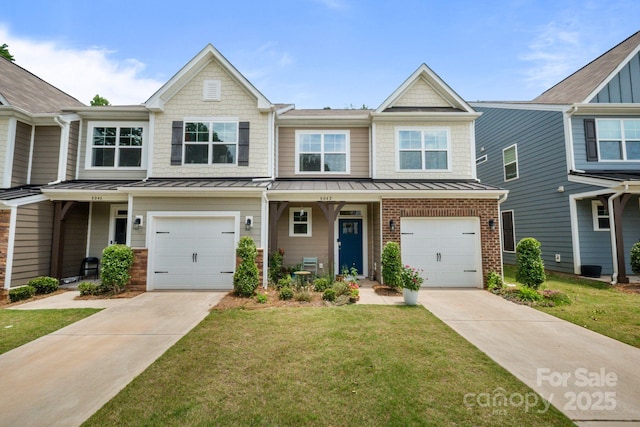 8042 Saluda Dr Unit 3, Charlotte, NC 28269 - townhome / multi-family property with concrete driveway, a standing seam roof, and a front lawn