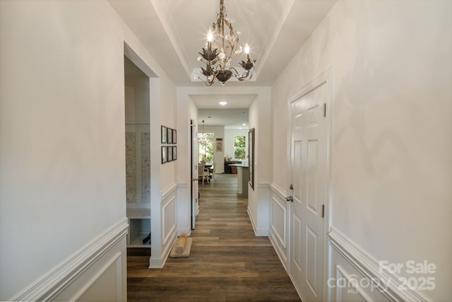 8042 Saluda Dr Unit 3, Charlotte, NC 28269 - corridor featuring a chandelier, dark wood-type flooring, a decorative wall, recessed lighting, and a raised ceiling