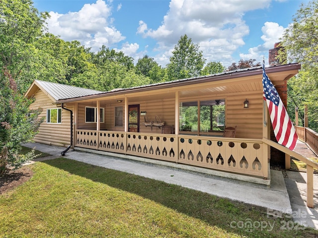 185 Indian Springs Rd, Clyde, NC 28721 - view of front facade with faux log siding and a metal roof