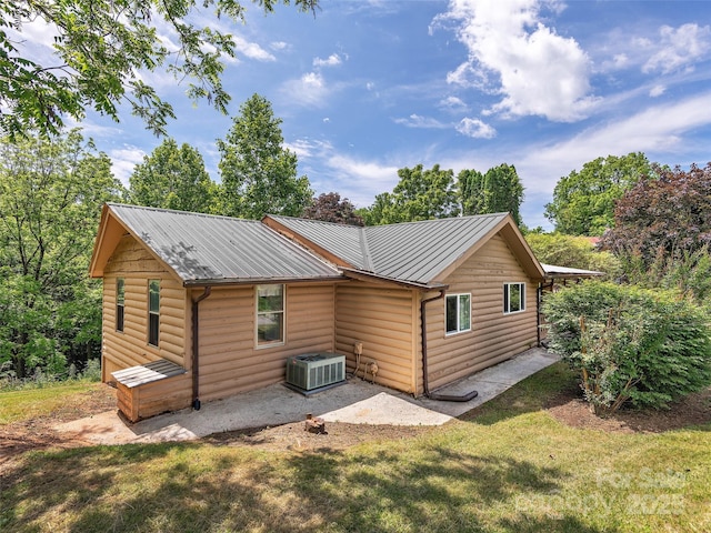 185 Indian Springs Rd, Clyde, NC 28721 - back of property featuring log veneer siding, a yard, a metal roof, and a patio area