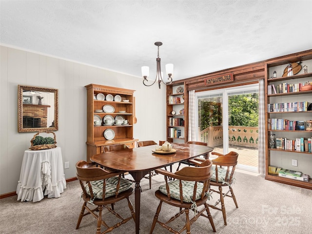 185 Indian Springs Rd, Clyde, NC 28721 - dining space featuring a chandelier, light colored carpet, crown molding, and a textured ceiling