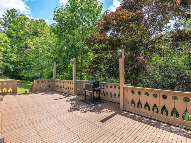 185 Indian Springs Rd, Clyde, NC 28721 - wooden terrace featuring a grill and view of scattered trees