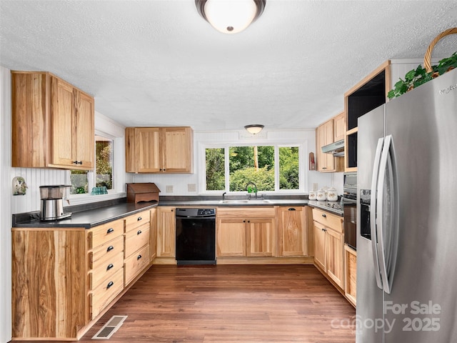 185 Indian Springs Rd, Clyde, NC 28721 - kitchen featuring black appliances, a textured ceiling, dark wood-style floors, dark countertops, and light brown cabinetry