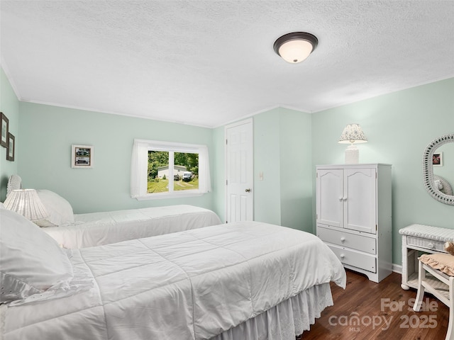 185 Indian Springs Rd, Clyde, NC 28721 - bedroom featuring dark wood finished floors and a textured ceiling