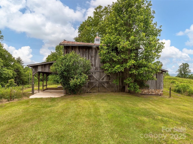 185 Indian Springs Rd, Clyde, NC 28721 - view of green lawn with an outbuilding and a barn