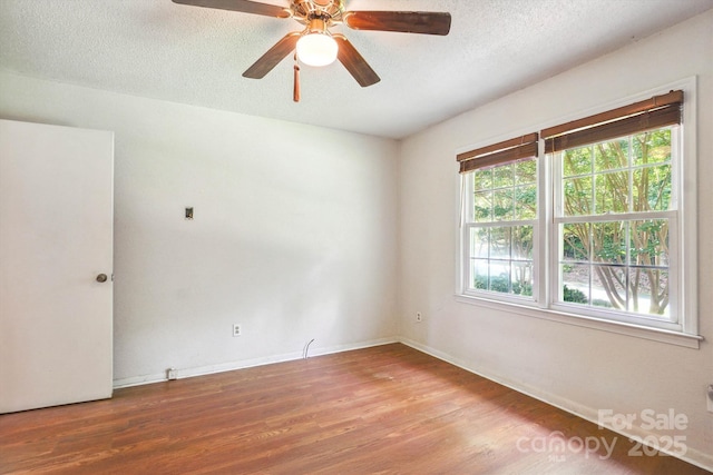 8706 Richardson King Rd, Waxhaw, NC 28173 - unfurnished room featuring wood finished floors, a ceiling fan, and a textured ceiling