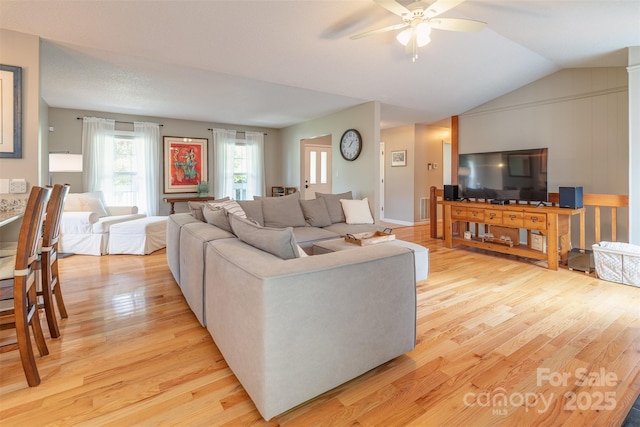 76 Woodland Hills Rd, Asheville, NC 28804 - living area featuring light wood-style floors, a ceiling fan, plenty of natural light, and vaulted ceiling