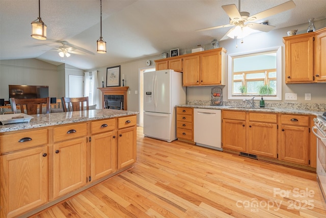 76 Woodland Hills Rd, Asheville, NC 28804 - kitchen with white appliances, ceiling fan, light wood-style floors, vaulted ceiling, and hanging light fixtures