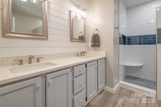 76 Woodland Hills Rd, Asheville, NC 28804 - full bathroom with double vanity, wood finished floors, and tiled shower