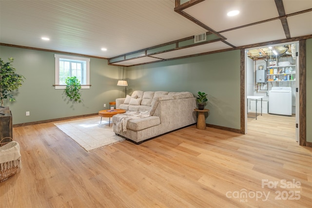 76 Woodland Hills Rd, Asheville, NC 28804 - living room with washer / clothes dryer, light wood finished floors, recessed lighting, water heater, and ornamental molding