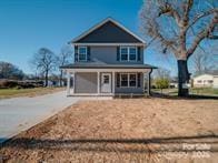 1017 W C St, Kannapolis, NC 28081 - american foursquare style home with covered porch and driveway