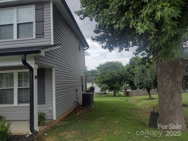 1017 W C St, Kannapolis, NC 28081 - view of property exterior featuring a lawn and a central air condition unit