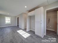 1017 W C St, Kannapolis, NC 28081 - unfurnished living room with baseboards and recessed lighting