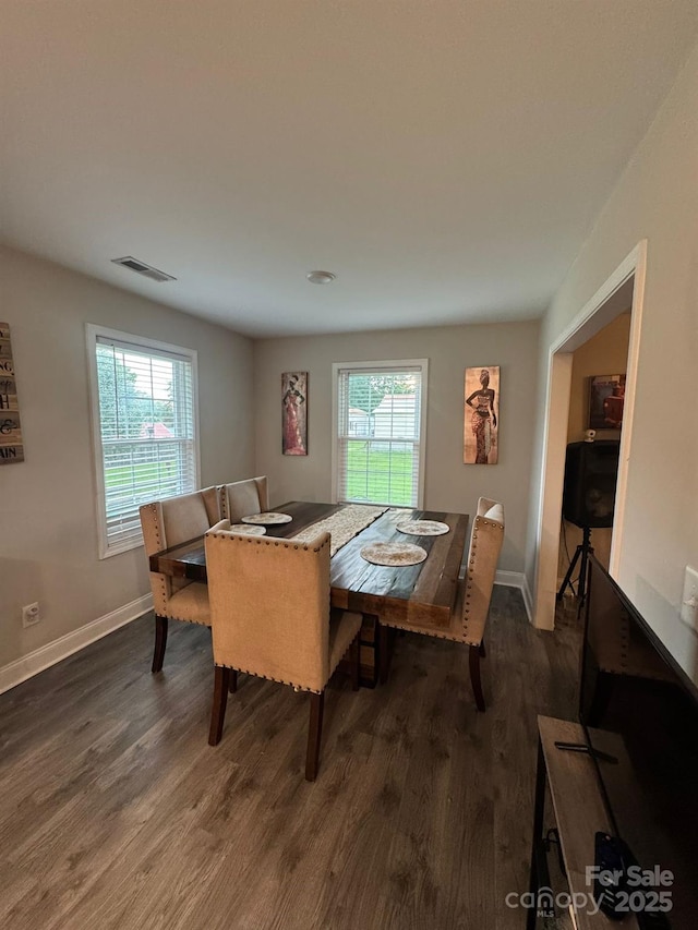 1017 W C St, Kannapolis, NC 28081 - dining space featuring dark wood-style flooring and baseboards