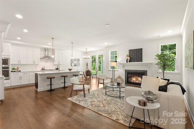 3222 Player Ct, Salisbury, NC 28144 - living room with recessed lighting, a glass covered fireplace, dark wood finished floors, and crown molding