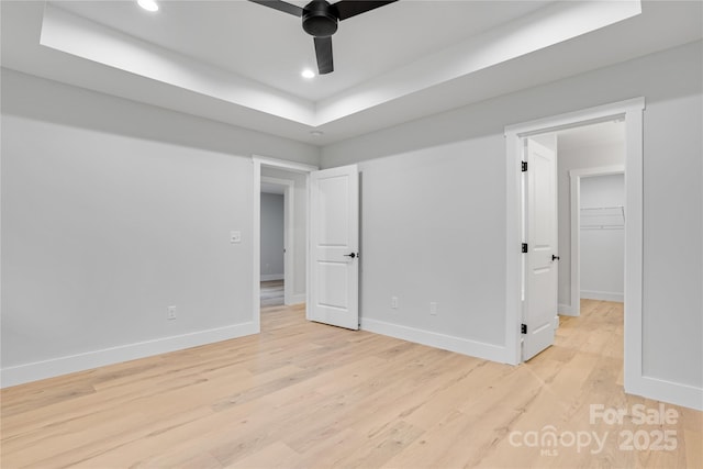 452 Duncan St, Spartanburg, SC 29306 - unfurnished room with recessed lighting, light wood finished floors, a tray ceiling, and a ceiling fan