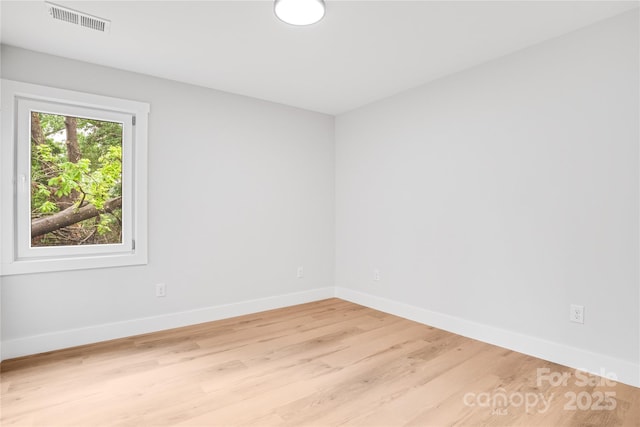 452 Duncan St, Spartanburg, SC 29306 - spare room featuring baseboards and light wood-style flooring