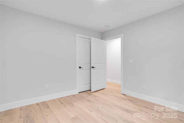 452 Duncan St, Spartanburg, SC 29306 - unfurnished bedroom with baseboards and light wood finished floors