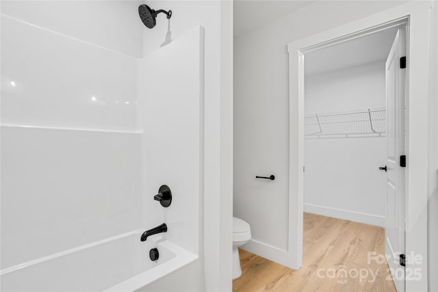 452 Duncan St, Spartanburg, SC 29306 - bathroom featuring shower / bath combination, wood finished floors, and a walk in closet