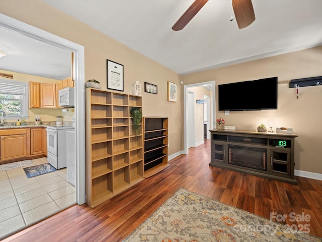 427 E 12th Ave, Gastonia, NC 28054 - living room featuring ceiling fan and wood finished floors